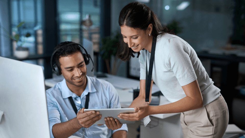man and woman looking at document